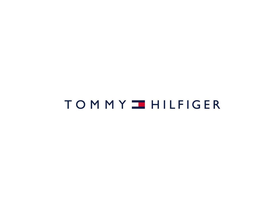 Tommy Hilfiger logo with red, white, and blue flag design on white background