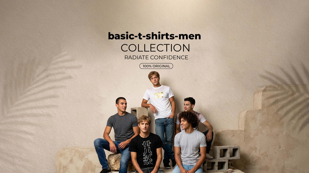 Assorted folded basic t-shirts in multiple colors neatly displayed on a wooden table in a bedroom.